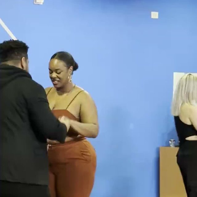 A couple practicing a salsa step during a Salsa Dance LA lesson